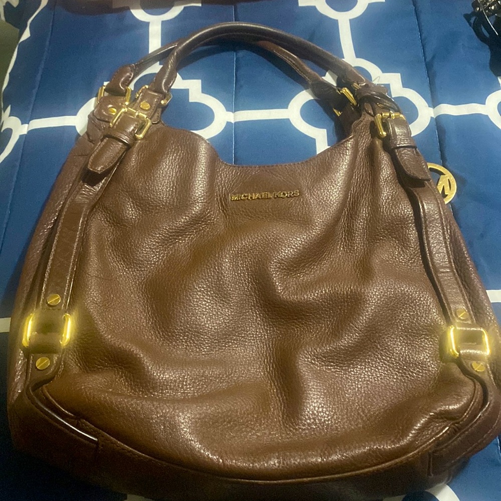 Michael kors brown tote! Ripped in the inside, but otherwise in good condition